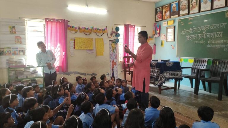 Students touching, building, and exploring in hands-on learning session